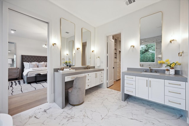 806 Holton St, Bellaire, TX 77401 - bathroom with two vanities and connected bathroom