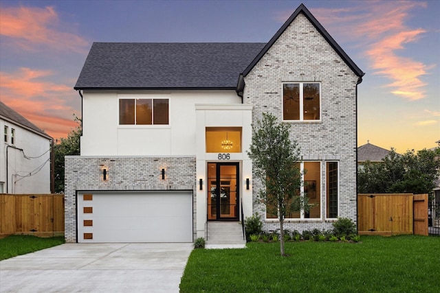 806 Holton St, Bellaire, TX 77401 - contemporary home with brick siding, a gate, a garage, driveway, and roof with shingles