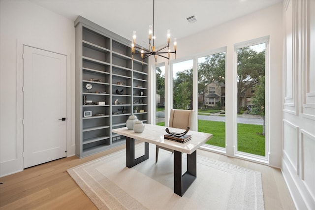 806 Holton St, Bellaire, TX 77401 - office space with a chandelier, built in features, and light wood-type flooring
