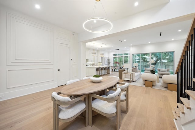 806 Holton St, Bellaire, TX 77401 - dining room with light wood finished floors, stairway, and recessed lighting