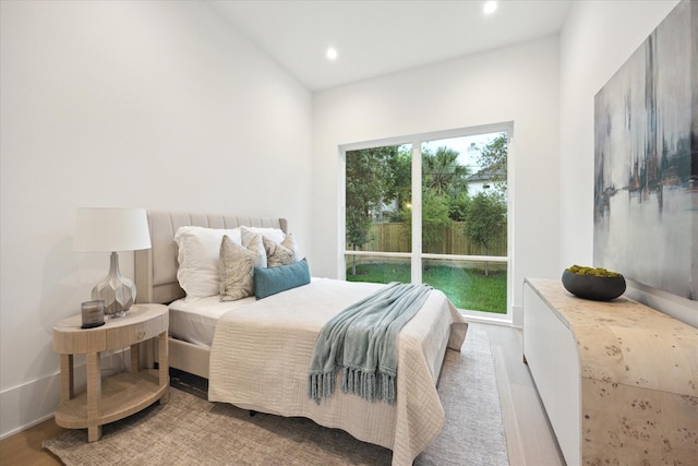 806 Holton St, Bellaire, TX 77401 - bedroom with wood finished floors and recessed lighting