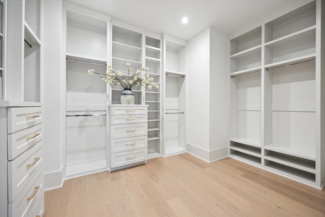 806 Holton St, Bellaire, TX 77401 - walk in closet featuring light wood finished floors