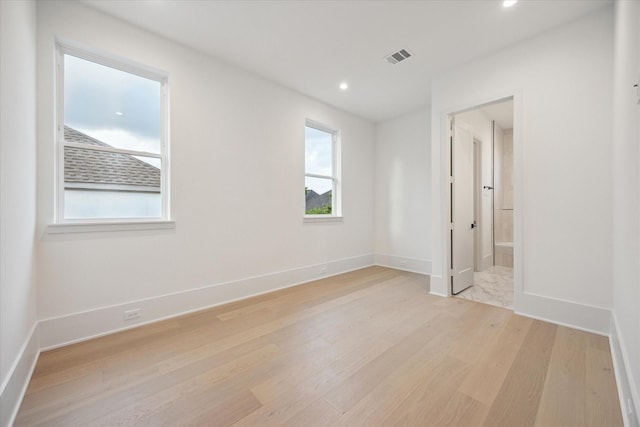 806 Holton St, Bellaire, TX 77401 - unfurnished bedroom featuring light wood-type flooring, recessed lighting, baseboards, and ensuite bathroom