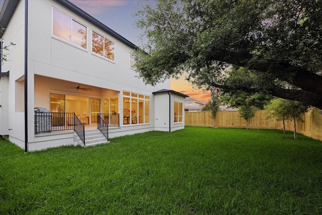 806 Holton St, Bellaire, TX 77401 - rear view of house featuring stucco siding and ceiling fan