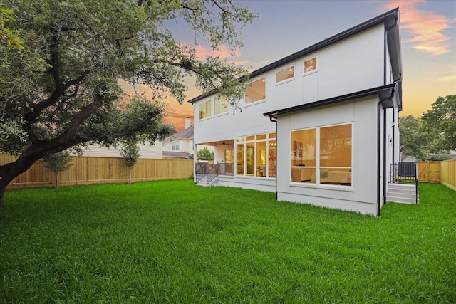 806 Holton St, Bellaire, TX 77401 - back of house at dusk with stucco siding