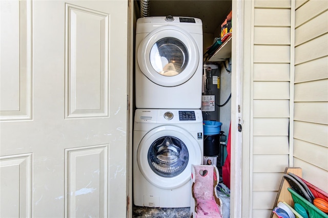 18218 Heritage Ln Unit 8218, Houston, TX 77058 - washroom with stacked washer / drying machine and water heater