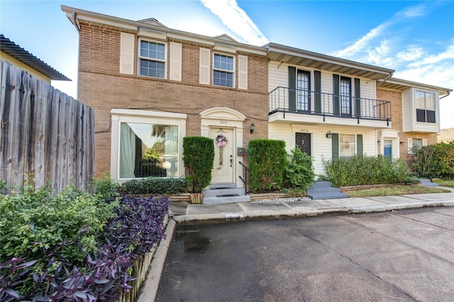 18218 Heritage Ln Unit 8218, Houston, TX 77058 - townhome / multi-family property with a balcony and brick siding