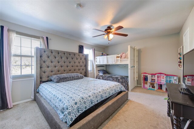 18218 Heritage Ln Unit 8218, Houston, TX 77058 - carpeted bedroom with multiple windows, baseboards, and a ceiling fan