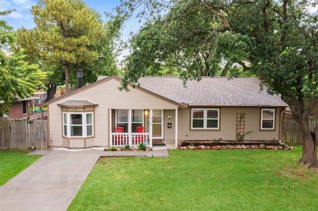 1518 14th Ave N, Texas City, TX 77590 - single story home with a porch, roof with shingles, and driveway