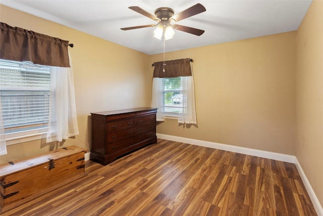 1518 14th Ave N, Texas City, TX 77590 - empty room featuring a ceiling fan, wood finished floors, and baseboards