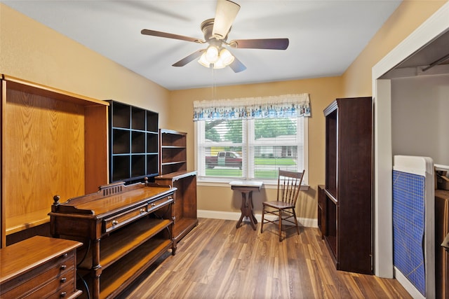1518 14th Ave N, Texas City, TX 77590 - home office with baseboards, a ceiling fan, and wood finished floors