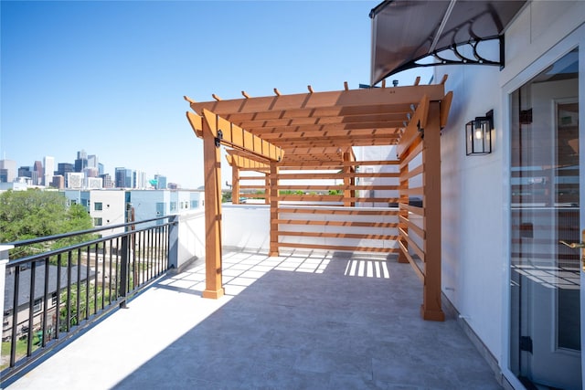 2117 Sauer St, Houston, TX 77004 - view of patio with a balcony, a view of skyline, and a pergola