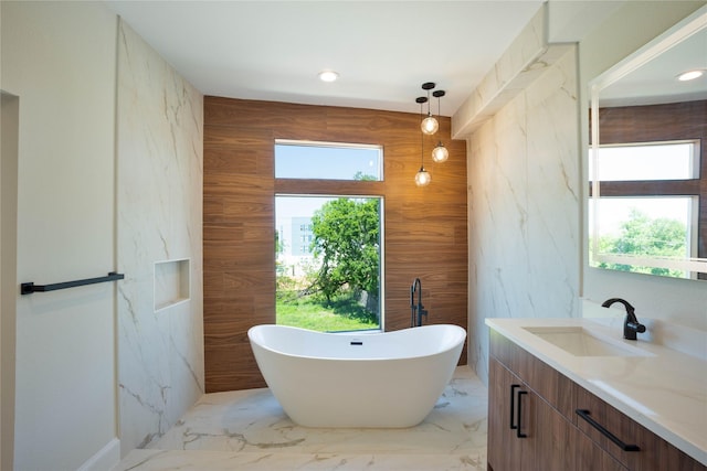 2117 Sauer St, Houston, TX 77004 - full bath with a freestanding bath, vanity, marble finish flooring, and recessed lighting