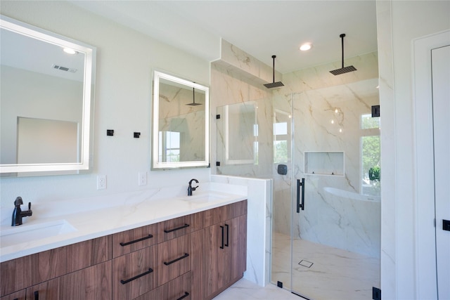 2117 Sauer St, Houston, TX 77004 - bathroom featuring a marble finish shower, double vanity, recessed lighting, and marble finish floors