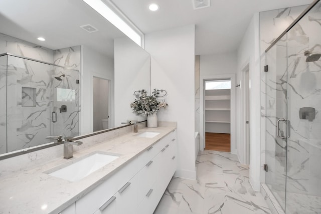 3002B Ventas Dr, Houston, TX 77047 - bathroom featuring marble finish floors, double vanity, a marble finish shower, recessed lighting, and toilet