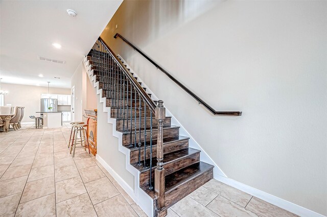 6702 Utah St, Houston, TX 77091 - stairs with tile patterned floors, baseboards, and recessed lighting