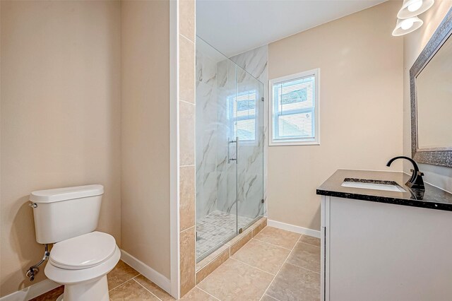 6702 Utah St, Houston, TX 77091 - bathroom with vanity, toilet, a marble finish shower, baseboards, and tile patterned floors