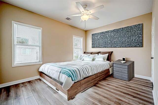 6702 Utah St, Houston, TX 77091 - bedroom with baseboards, light wood-style flooring, and ceiling fan