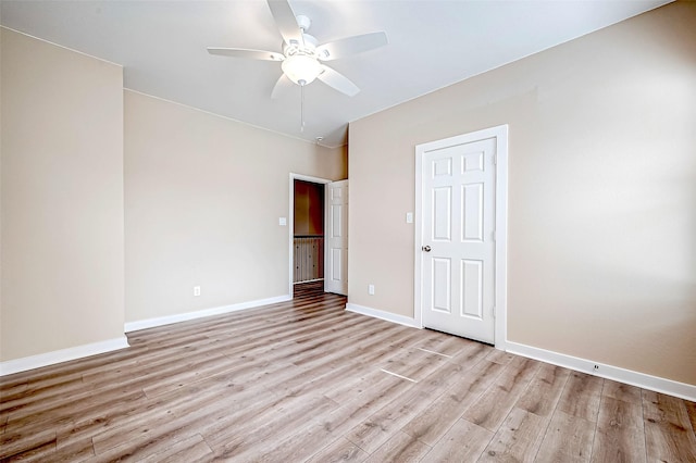 6702 Utah St, Houston, TX 77091 - unfurnished bedroom with light wood-style flooring, baseboards, and a ceiling fan