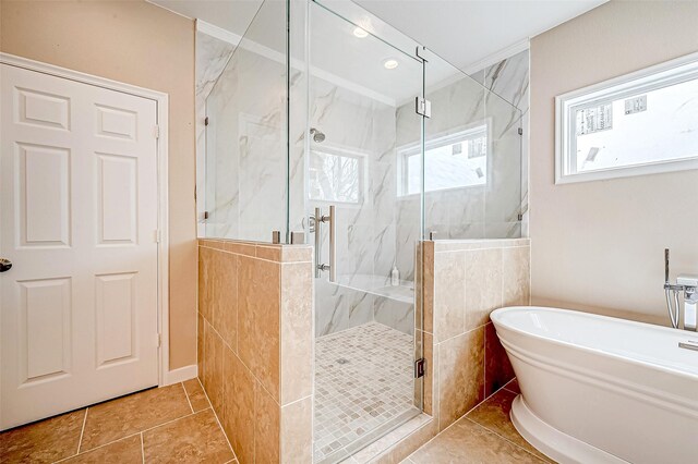6702 Utah St, Houston, TX 77091 - bathroom featuring a freestanding tub, a marble finish shower, and tile patterned flooring