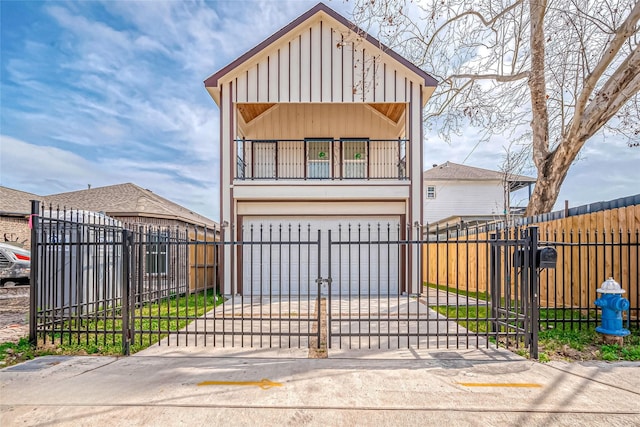 6702 Utah St, Houston, TX 77091 - view of front of property with board and batten siding, a balcony, a garage, a gate, and driveway