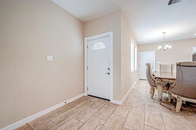 6702 Utah St, Houston, TX 77091 - entryway featuring a chandelier and baseboards