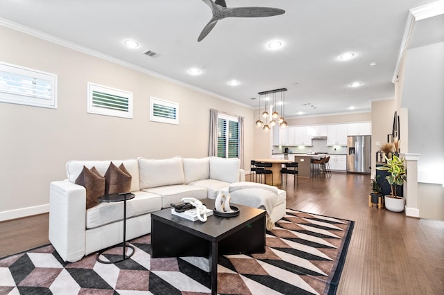 1834 Bonner St, Houston, TX 77007 - living room with crown molding, dark wood-type flooring, a ceiling fan, recessed lighting, and baseboards