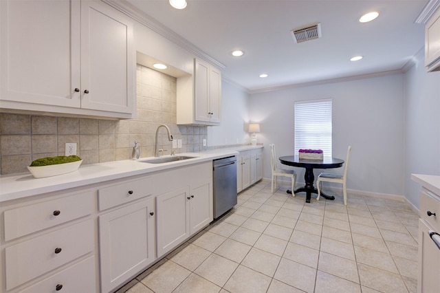 502 Enid St, Houston, TX 77009 - kitchen featuring a sink, stainless steel dishwasher, ornamental molding, baseboards, and tasteful backsplash