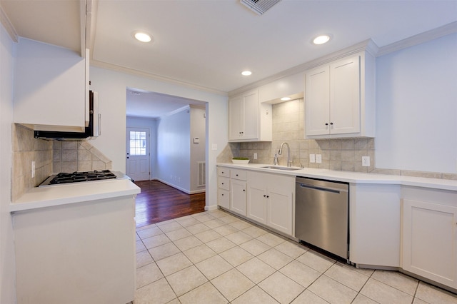 502 Enid St, Houston, TX 77009 - kitchen with appliances with stainless steel finishes, a sink, crown molding, white cabinets, and light countertops