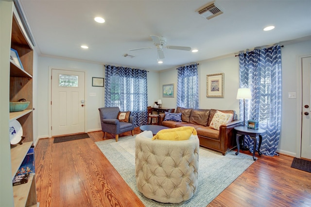 502 Enid St, Houston, TX 77009 - living area featuring crown molding, a ceiling fan, wood finished floors, recessed lighting, and baseboards