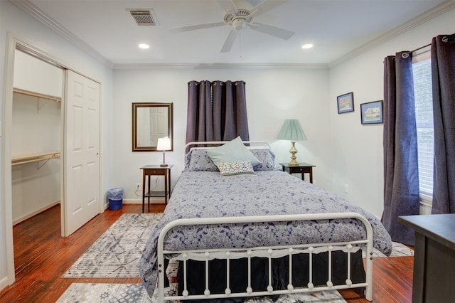 502 Enid St, Houston, TX 77009 - bedroom with ornamental molding, wood finished floors, a closet, recessed lighting, and baseboards