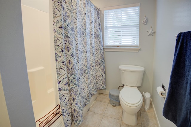 502 Enid St, Houston, TX 77009 - bathroom with toilet, tile patterned flooring, a shower with shower curtain, and baseboards