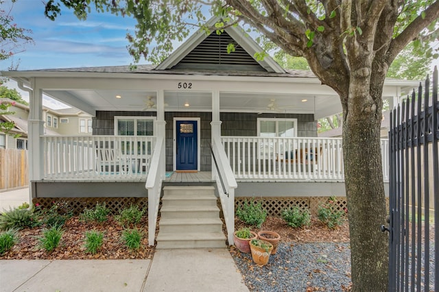 502 Enid St, Houston, TX 77009 - view of front of house featuring covered porch, ceiling fan, and roof with shingles