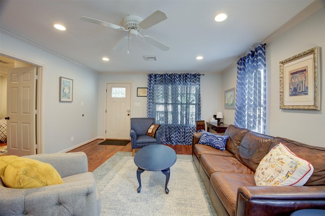 502 Enid St, Houston, TX 77009 - living room with ornamental molding, recessed lighting, wood finished floors, ceiling fan, and baseboards