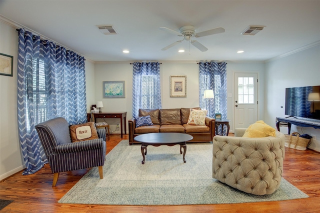 502 Enid St, Houston, TX 77009 - living room with crown molding, wood finished floors, a ceiling fan, baseboards, and recessed lighting