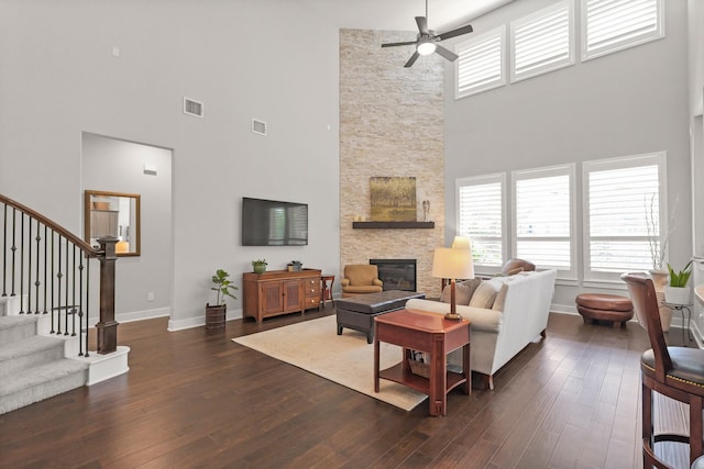 6602 Rochester Lake Loop, Katy, TX 77493 - living area featuring a high ceiling, a ceiling fan, stairway, healthy amount of natural light, and a stone fireplace