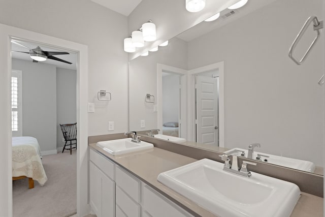 6602 Rochester Lake Loop, Katy, TX 77493 - bathroom featuring ensuite bathroom, double vanity, and baseboards