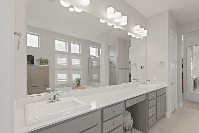 6602 Rochester Lake Loop, Katy, TX 77493 - full bathroom with tile patterned floors, double vanity, and a shower stall