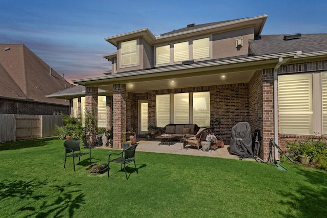 6602 Rochester Lake Loop, Katy, TX 77493 - rear view of house with a patio area, brick siding, an outdoor living space, and a shingled roof