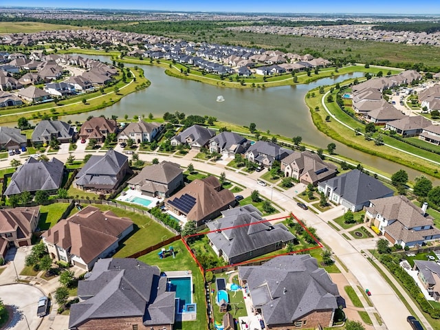 6602 Rochester Lake Loop, Katy, TX 77493 - aerial perspective of suburban area featuring property parcel outlined and a large body of water