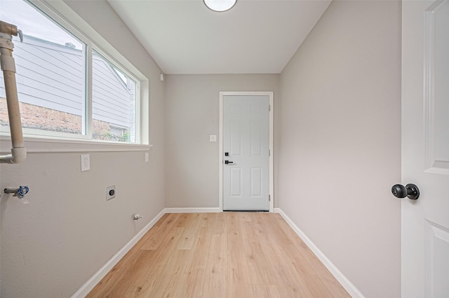 10623 Dunvegan Way, Houston, TX 77013 - laundry room featuring electric dryer hookup, light wood finished floors, baseboards, and gas dryer hookup