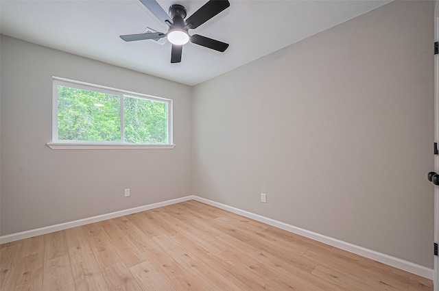 10623 Dunvegan Way, Houston, TX 77013 - spare room with baseboards, light wood-style floors, and a ceiling fan