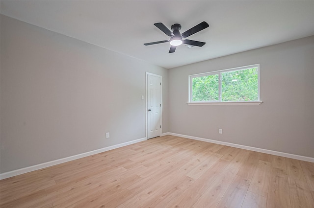 10623 Dunvegan Way, Houston, TX 77013 - unfurnished room featuring baseboards, light wood-type flooring, and a ceiling fan