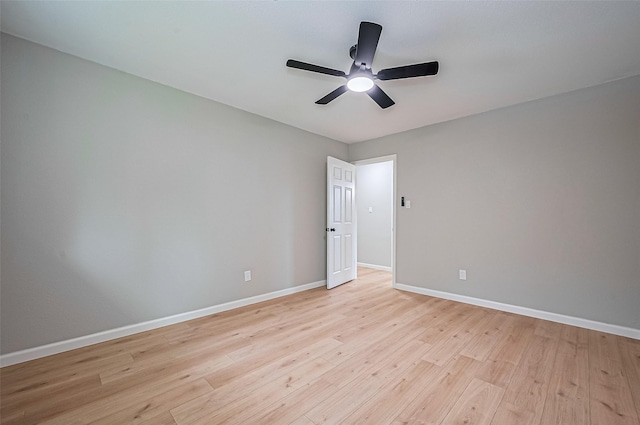 10623 Dunvegan Way, Houston, TX 77013 - spare room with ceiling fan, baseboards, and light wood-style floors