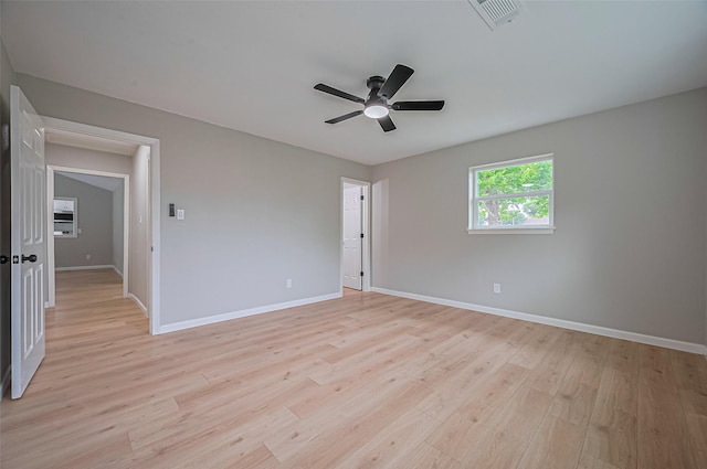 10623 Dunvegan Way, Houston, TX 77013 - spare room featuring a ceiling fan, light wood-type flooring, and baseboards