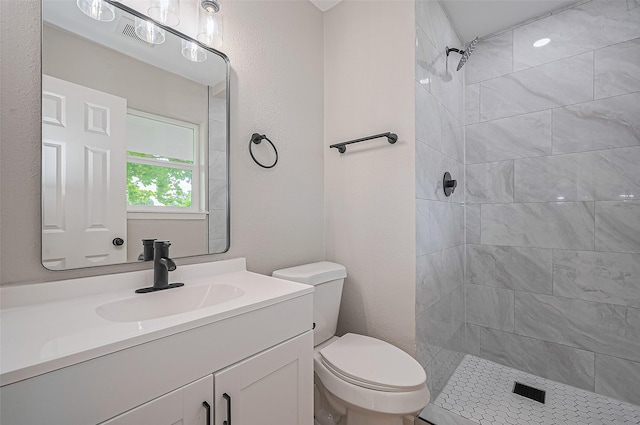 10623 Dunvegan Way, Houston, TX 77013 - bathroom with toilet, tiled shower, and vanity