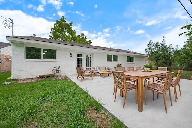 10623 Dunvegan Way, Houston, TX 77013 - rear view of property with french doors, a patio area, an outdoor living space, a yard, and outdoor dining area