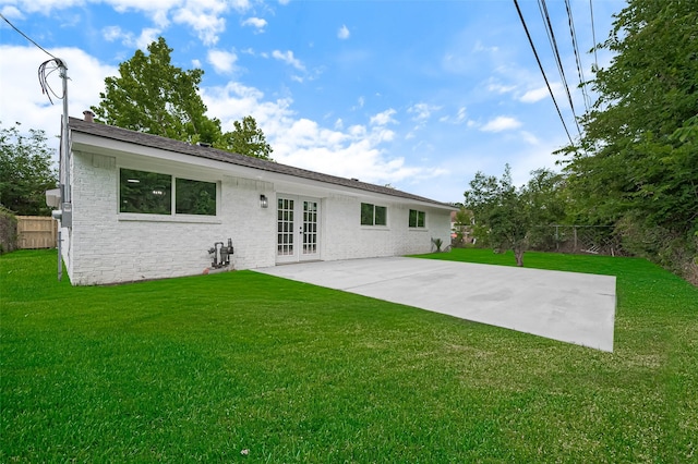 10623 Dunvegan Way, Houston, TX 77013 - back of property with french doors, a patio, and brick siding