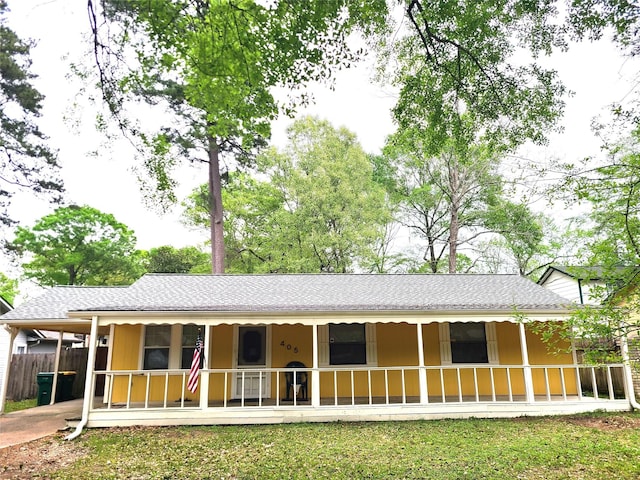 405 Wakefield Rd, Conroe, TX 77316 - view of front of home with covered porch and roof with shingles