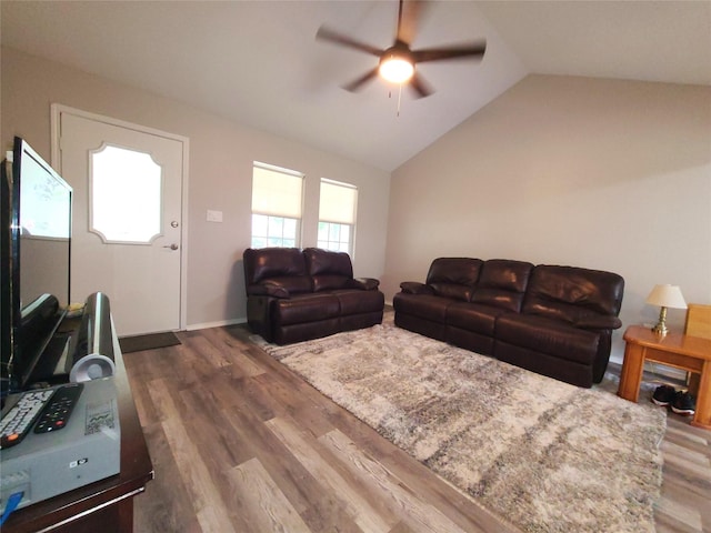 405 Wakefield Rd, Conroe, TX 77316 - living area with a ceiling fan, vaulted ceiling, wood finished floors, and baseboards